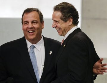 New Jersey Gov. Chris Christie, left, and New York Gov. Andrew Cuomo meet during the dedication ceremony in Foundation Hall, of the National September 11 Memorial Museum, in New York, Thursday, May 15, 2014. (AP Photo/Richard Drew, Pool)