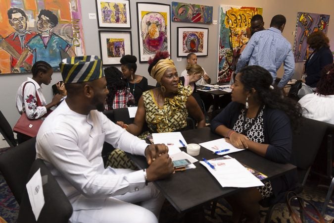 Chester Made workshop leader Sistah Mafalda (center) sits with Mandela Washington Fellows, Sunday Gift Unekwuojo Agbonika (left) and Virginie Melissa Axelle Lagaillarde (right), during a working lunch at Brothers Restaurant and Juice Bar as part of the Chester Made and Mandela Washington Fellowship Exchange 2019. (Greg Irvin)