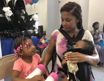 Saadya Elliott Dixon attended the Harper’s Heart event at Kingswood with her daughters, Sariyah, who is 3 years old, and Samiyah. (Cris Barrish/WHYY)