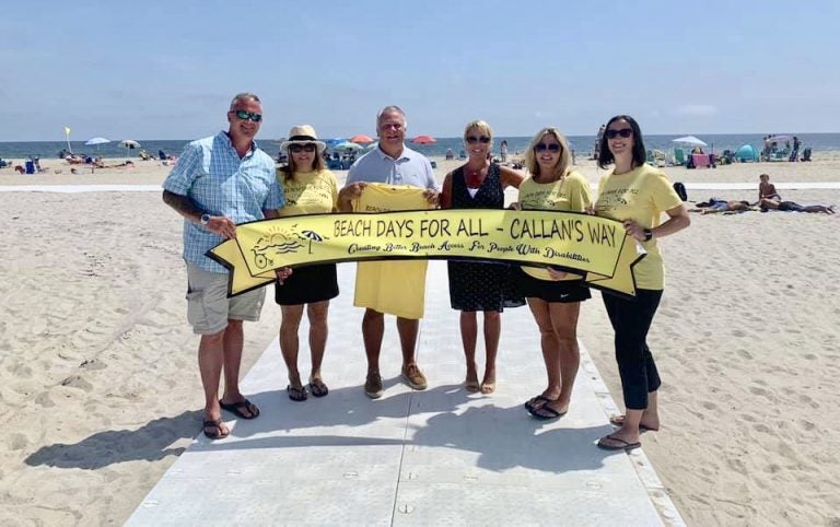 Beach Days for All founders Chris Aldrich (far left) and Jessica Miscio (second from right) stand with supporters Friday at the newly handicapped-accessible Maryland Avenue beach in Point Pleasant Beach. (Courtesy of Beach Days for All)