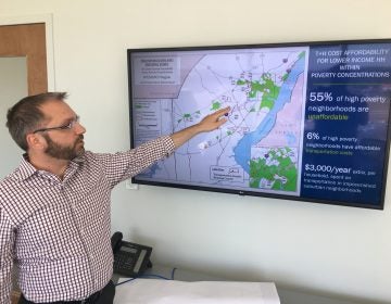 WILMAPCO’s Bill Swiatek points to a map from the group’s Transportation Justice Plan that shows the high cost of transportation and housing for those living in high poverty areas. (Mark Eichmann/WHYY)