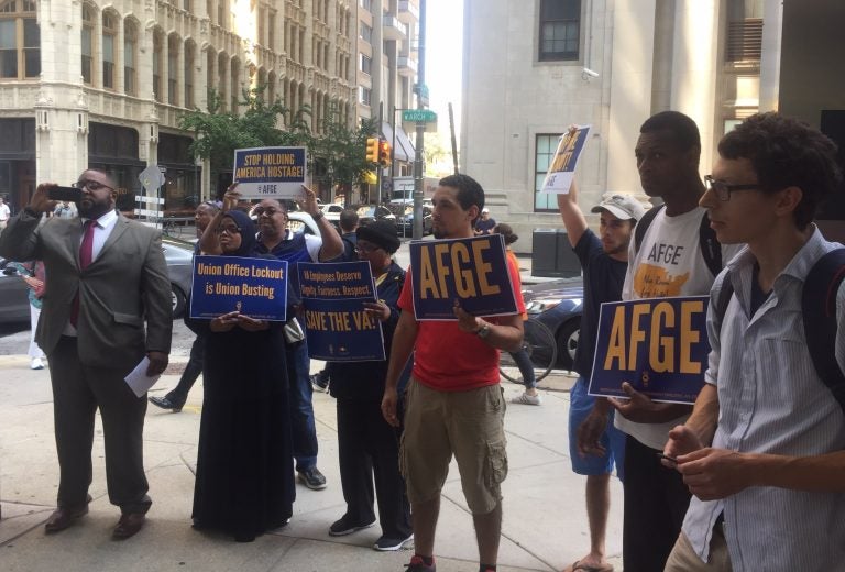 American Federation of Government Employees officials protest the new contract which requires them to vacate their offices in EPA headquarters across the country this week. (Susan Phillips/StateImpact Pennsylvania)