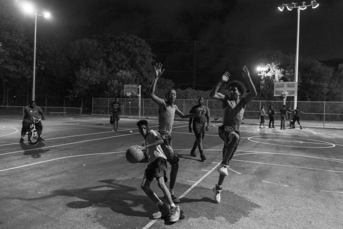 Friday night on the outdoor courts at the Hank Gathers Rec Center in July 2018. (Jessica Kourkounis for Keystone Crossroads)