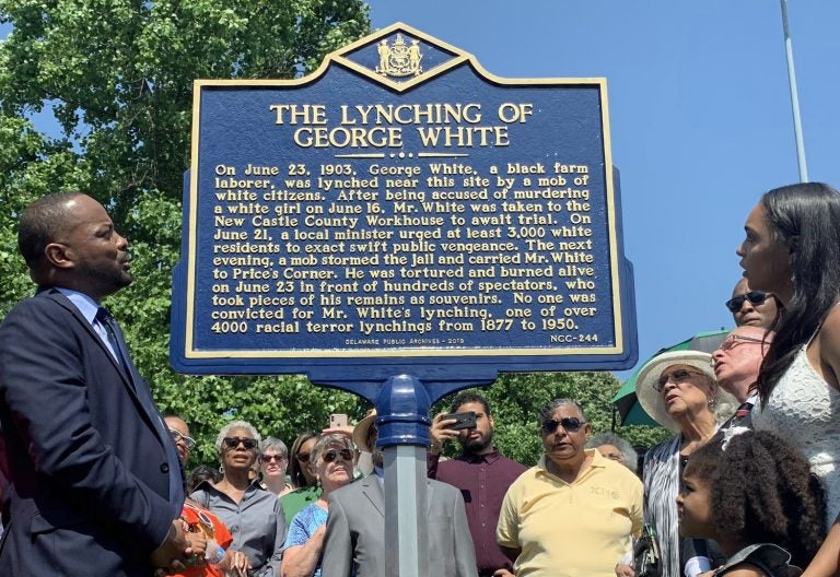 Sen. Darius Brown, Savannah Shepherd and others read the words on The Lynching of George White Historical Marker just minutes after it was unveiled at Greenbank Park on June 23. (Scott Goss/Delaware Senate Majority Caucus) 