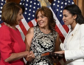 House Speaker Nancy Pelosi of Calif., left, talks with Rep. Alexandria Ocasio-Cortez, D-N.Y., right, and her mother Blanca Ocasio-Cortez, center, during a ceremonial swearing-in on Capitol Hill in Washington, Thursday, Jan. 3, 2019, during the opening session of the 116th Congress. (AP Photo/Susan Walsh)