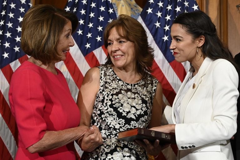 House Speaker Nancy Pelosi of Calif., left, talks with Rep. Alexandria Ocasio-Cortez, D-N.Y., right, and her mother Blanca Ocasio-Cortez, center, during a ceremonial swearing-in on Capitol Hill in Washington, Thursday, Jan. 3, 2019, during the opening session of the 116th Congress. (AP Photo/Susan Walsh)