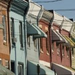 Rowhouses line North 29th Street in Philadelphia