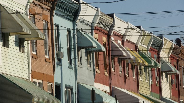 Rowhouses line North 29th Street in Philadelphia