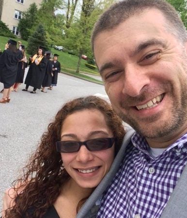 Student and former principal pose for a selfie after Zuleika Roman earns her associate's degree in 2016. (Photo provided by Zuleika Roman)