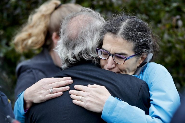 People embrace along the street in the Squirrel Hill neighborhood of Pittsburgh where a shooter opened fire during services at the Tree of Life Synagogue on Saturday, Oct. 27, 2018. (Keith Srakocic/AP Photo)