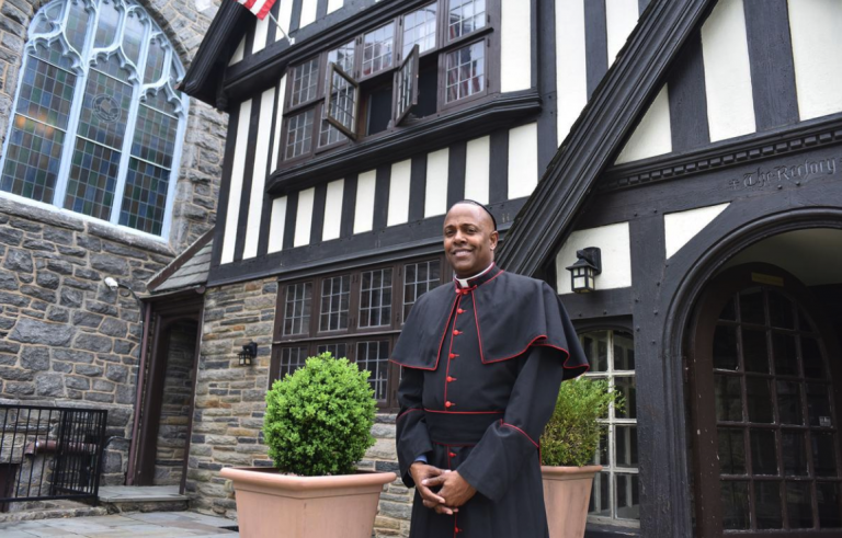 The Very Rev. Canon Martini Shaw stands outside of the African Episcopal Church of St. Thomas. (Ronald Gray/The Philadelphia Tribune)