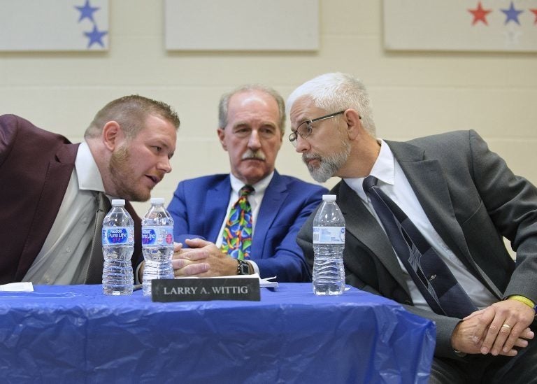 Tamaqua School board member Nicholas Boyle (left) and School Board President Larry Wittig (center) are joined by Joe Egan, a representative of The Buckeye Firearm Foundation at a meeting in November 2018. (Matt Smith for Keystone Crossroads)