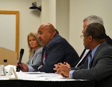 Department of Corrections Secretary John Wetzel, center, talks to reporters Aug. 28, 2019. (Brett Sholtis/WITF)