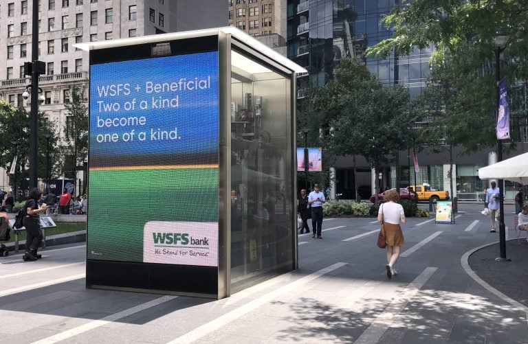 One of the many billboards used to announce the change of Beneficial Bank branches to WSFS Bank.  This one is in Dilworth Park in Center City.  The change will be complete on Monday, Aug. 26. (P. Kenneth Burns/WHYY)