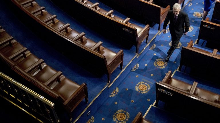 Senate Majority Leader Mitch McConnell of Kentucky walks off the House floor in April. In his chamber, McConnell can decide virtually by himself what the Senate will do — and even what it will consider doing. (Andrew Harnik/AP Photo)