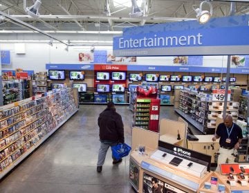 Walmart has instructed employees to remove marketing material that displays violent imagery and to unplug or turn off video game consoles that show violent games. (AP Photo)