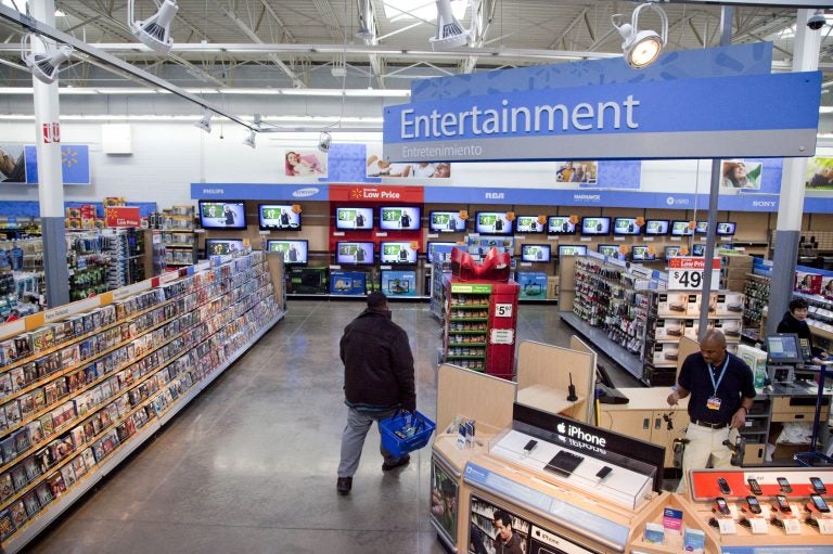 Walmart has instructed employees to remove marketing material that displays violent imagery and to unplug or turn off video game consoles that show violent games. (AP Photo)