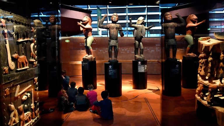 Big royal statues from the Kingdom of Dahomey, in present-day Benin, are pictured in 2018 at the Quai Branly Museum in Paris. (Gerard Julien/AFP/Getty Images)
