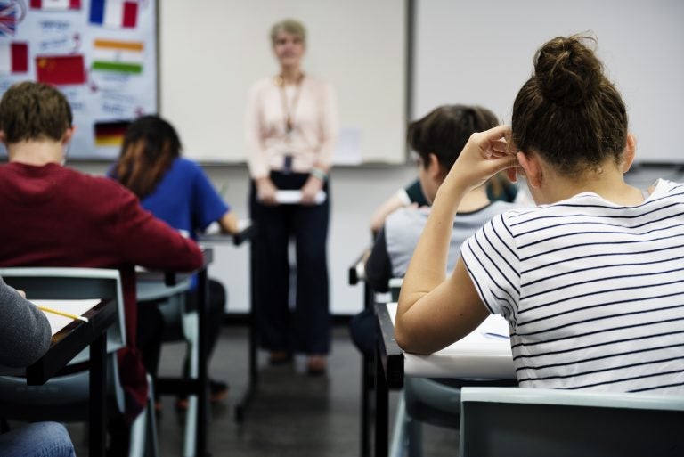 Students doing the exam in classroom