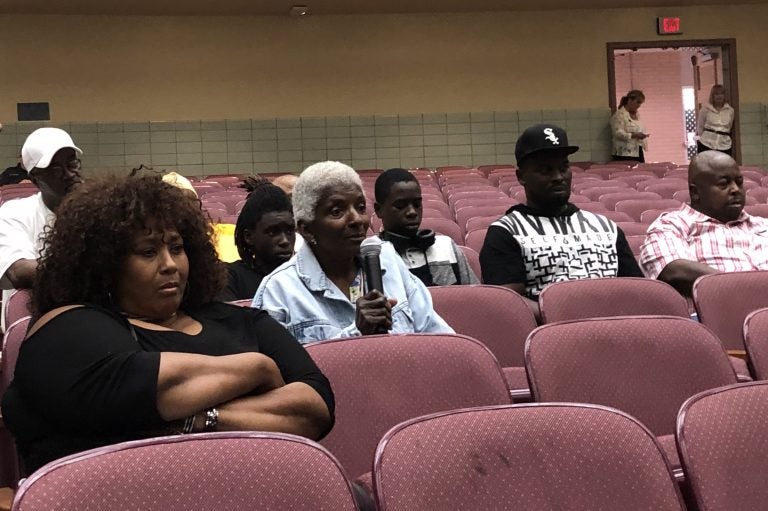 A woman who lives near the Croda chemical plant questions company and state officials during a meeting about November’s toxic release and steps being taken before the plant can resume making ethylene oxide. (Cris Barrish/WHYY)