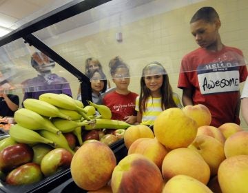 Students select food items from the lunch line of the cafeteria at Draper Middle School in Rotterdam, N.Y. (AP Photo/Hans Pennink)