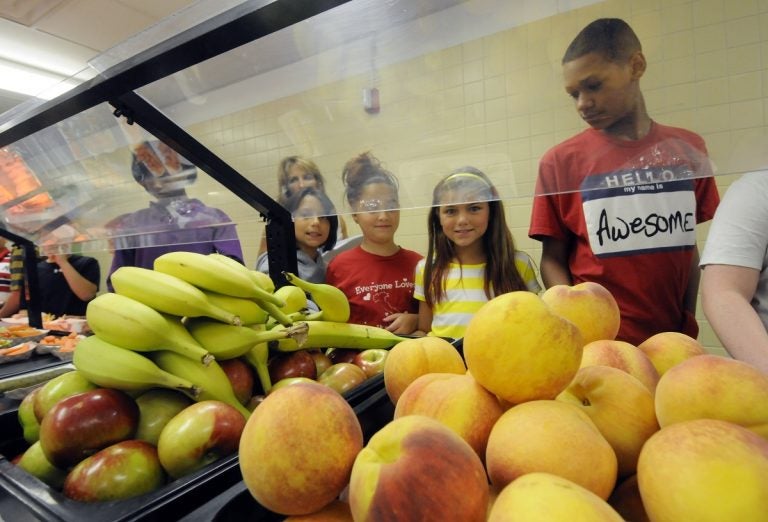 Students select food items from the lunch line of the cafeteria at Draper Middle School in Rotterdam, N.Y. (AP Photo/Hans Pennink)