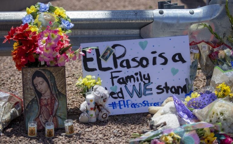 Flowers and a Virgin Mary painting adorn makeshift memorial for the victims of Saturday mass shooting at a shopping complex in El Paso, Texas, Sunday, August 4, 2019. (Andres Leighton/AP Photo)