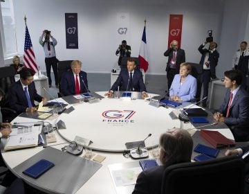 From the left, Italian Prime Minister, Giuseppe Conte, Japanese Prime Minister Shinzo Abe, U.S President Donald Trump, French President Emmanuel Macron, German Chancellor Angela Merkel, Canadian Prime Minister Justin Trudeau, Britain's Prime Minister Boris Johnson attend a work session during the G7 summit at Casino in Biarritz, southwestern France, Monday Aug.26 2019. G-7 leaders are wrapping up a summit dominated by tensions over U.S. trade policies and a surprise visit by Iran's top diplomat. (Ian Langsdon, Pool via AP)