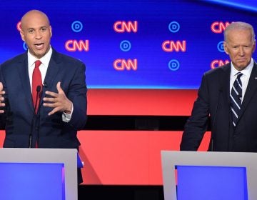 New Jersey Sen. Cory Booker delivers his closing statement flanked by former Vice President Joe Biden during the Democratic presidential debate in Detroit on Wednesday night. Booker pressed Biden on his record on criminal justice. (Jim Watson/AFP/Getty Images)