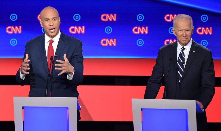 New Jersey Sen. Cory Booker delivers his closing statement flanked by former Vice President Joe Biden during the Democratic presidential debate in Detroit on Wednesday night. Booker pressed Biden on his record on criminal justice. (Jim Watson/AFP/Getty Images)