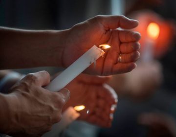 People light candles during a prayer and candle vigil organized by the city, after the recent shooting at a WalMart in El Paso, Texas.
(Mark Ralston/AFP/Getty Images)