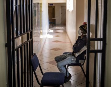 A South African patient with drug-resistant tuberculosis waits to be seen by a doctor at a Johannesburg hospital. (Michele Spatari /AFP/Getty Images)