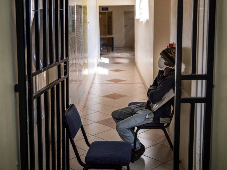 A South African patient with drug-resistant tuberculosis waits to be seen by a doctor at a Johannesburg hospital. (Michele Spatari /AFP/Getty Images)