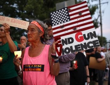 Sandi Lisko attends a vigil for recent victims of gun violence outside the National Rifle Association's headquarters building, Monday, Aug. 5, 2019, in Fairfax, Va. (AP Photo/Patrick Semansky)