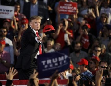 President Donald Trump tosses a hat during a campaign rally in Montoursville, Pa., Monday, May 20, 2019. (Matt Rourke / The Associated Press)