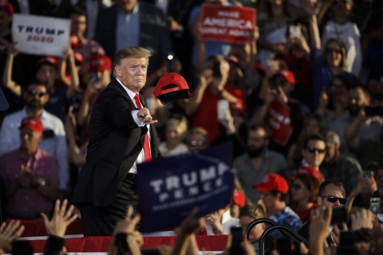 President Donald Trump tosses a hat during a campaign rally in Montoursville, Pa., Monday, May 20, 2019. (Matt Rourke / The Associated Press)