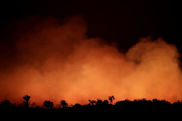 Smoke billows during a fire in an area of the Amazon rainforest near Humaita, Brazil, on Aug. 17. (Ueslei Marcelino/Reuters)
