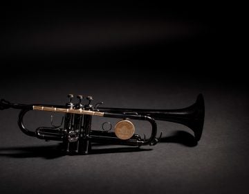 The Instrument of Hope is lacquered in black except for the shiny brass parts, which are clear lacquered. They include the lead pipe, which is made from bullets set end to end and drilled out so that air can flow through to make it a playable instrument. The tops of the three buttons are made of the sawn-off casing end caps or rims. (Matt Mckay/Publicis North America)