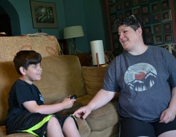 Owen Wagner, (left), smiles as he plays Mario Kart next to his mom, Gerren Wagner. Beginning in mid-August, Owen will lose his behavioral services through WellSpan. (Brett Sholtis/Transforming Health)