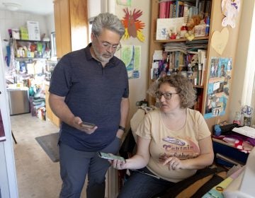 Ric Peralta and his wife Lisa are both able to check Ric's blood sugar levels at any time, using the Dexcom app and an arm patch that measures the levels and sends the information wirelessly. (Allison Zaucha for NPR)
