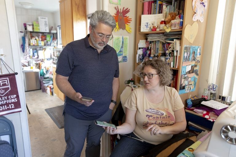 Ric Peralta and his wife Lisa are both able to check Ric's blood sugar levels at any time, using the Dexcom app and an arm patch that measures the levels and sends the information wirelessly. (Allison Zaucha for NPR)