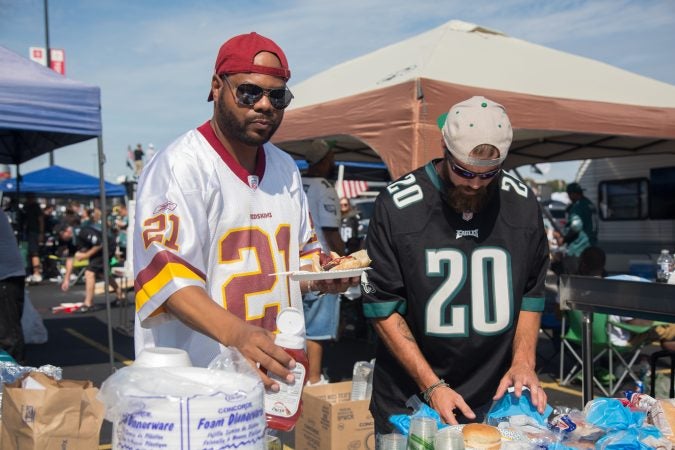 A group of friends from Coatesville have been coming together for 8 years for the Eagles season opener. Even though the team loyalties varies throughout the group, they love coming together to celebrate their love for football. (Emily Cohen for WHYY)