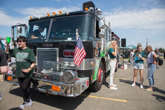 Fire Engine 81 brings the party with their repurposed fire truck at the Eagles opening day tailgate September 8th 2019. (Emily Cohen for WHYY)