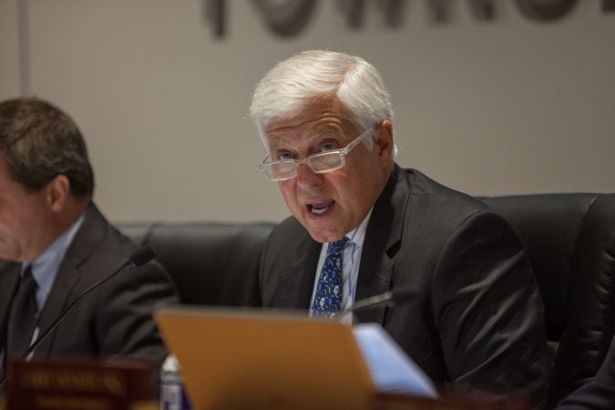 Andy Lewis, a township commissioner, reads off a statement from the township in relation to the Bon Air fire company. (Emily Cohen for WHYY)