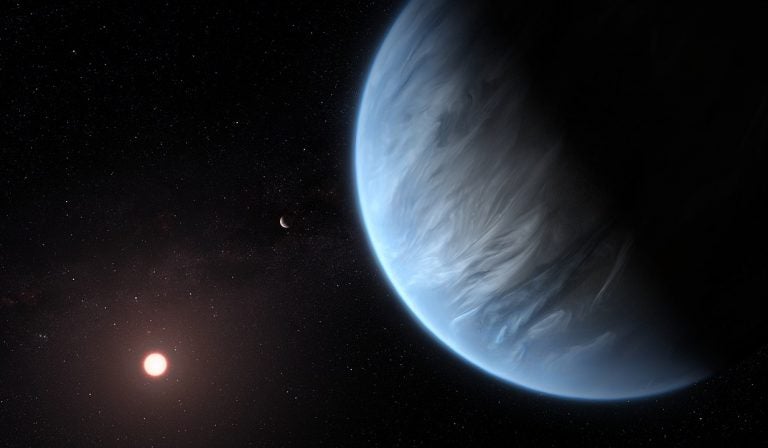 This artist's impression shows the planet K2-18b, its host star and an accompanying planet in this system. By ESA/Hubble, M. Kornmesser 