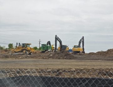 Crews work at the site of a sinkhole along the Mariner East pipeline route near the Pennsylvania State Police barracks on Route 1 in Delaware County on Thursday, April 25, 2019. Pipeline builder Sunoco said no pipelines were exposed and that the sinkhole was contained. (Kimberly Paynter/WHYY)