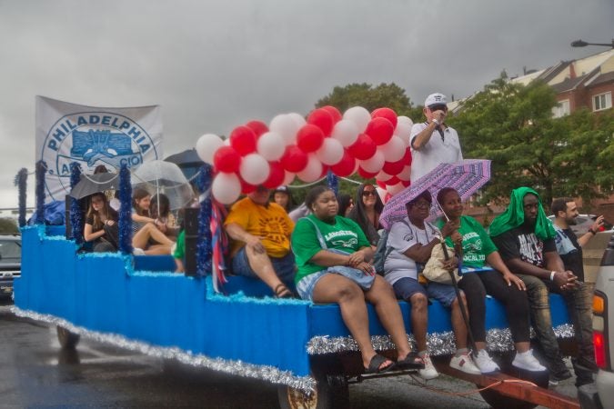 The American Federation of Labor and Congress of Industrial Organizations (AFL-CIO) float rolls down Delaware Avenue at Philadelphia’s 2019 Labor Day Parade. (Kimberly Paynter/WHYY)