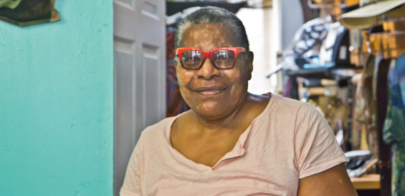 Phyllis Carter is the owner of a consignment shop on Lancaster Avenue. She’d like the former clinic building to become something totally unrelated to reproductive health. (Kimberly Paynter/WHYY)