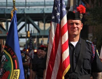 Representatives of Philadelphia's police, fire, and prisons departments line up on 2nd Street for the annual 9/11 remembrance procession. (Emma Lee/WHYY)