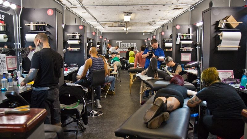 True Hand tattooing company took over the Terror Behind the Walls makeup and effects room to give free classic flash style tattoos to people who waited in line on Friday the 13th. (Kimberly Paynter/WHYY)
